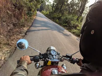 Riding motorbike in forest