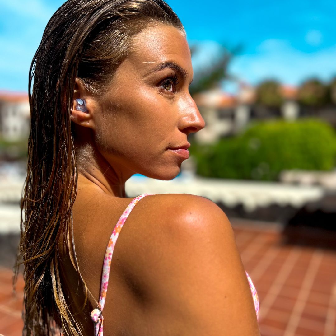 woman-looking-to-the-right-with-watersafe-earplugs-inserted.