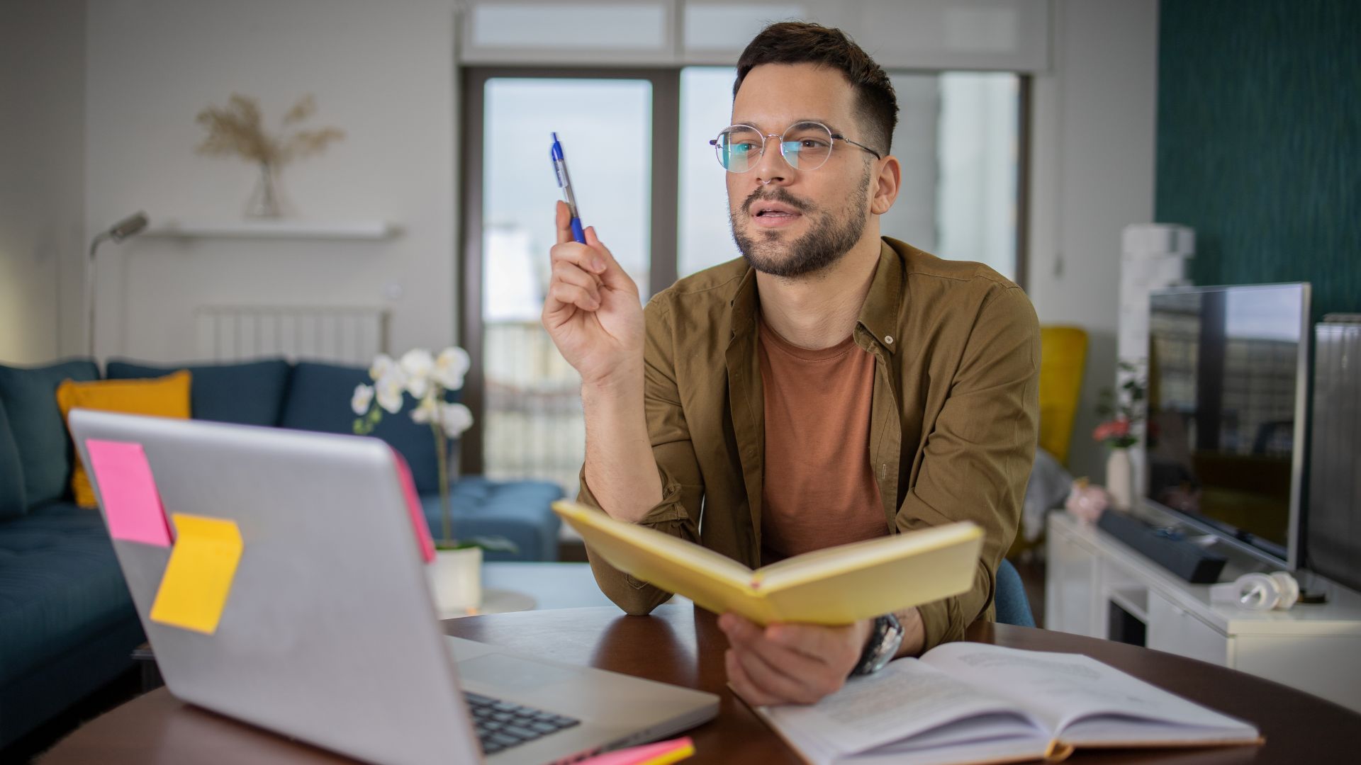 A man studying in front of laptop